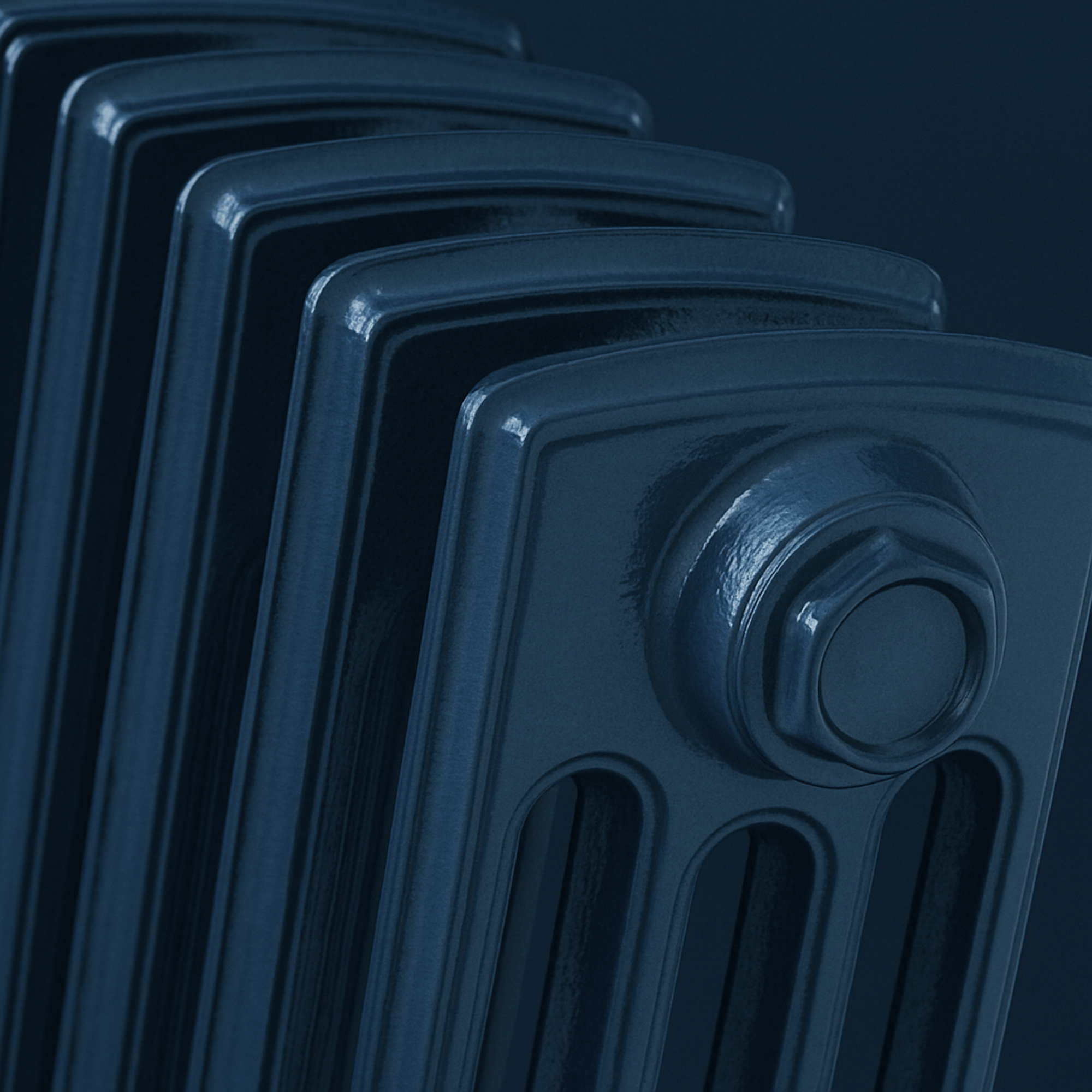 Close-up of a hague blue radiator against a matching hague blue background