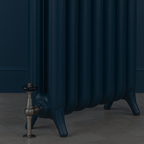 Hague blue radiator against a Hague blue wall on a tiled floor