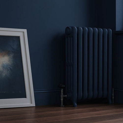 hague blue radiator against a hague blue wall with a framed picture on the left.
