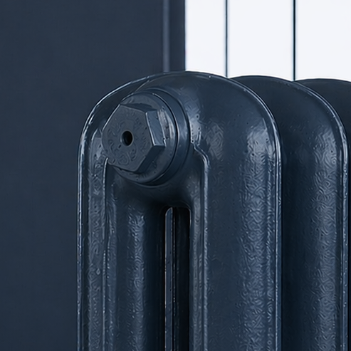 hague blue cast iron radiator close up on hague blue background