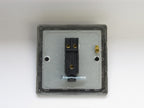 Electrical switch panel with black switch on a white background