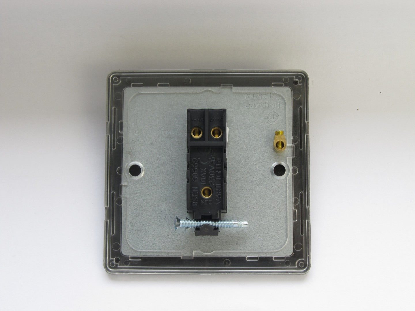 Electrical switch panel with black switch on a white background